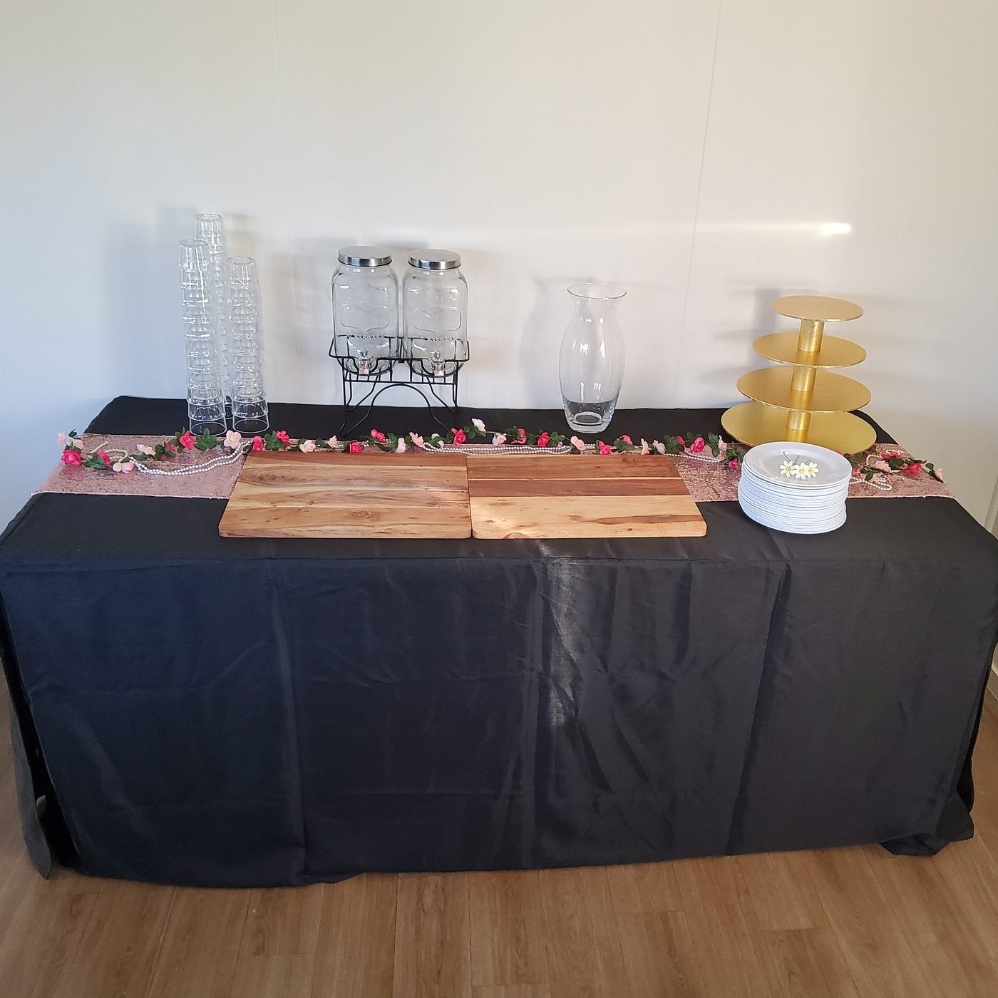 Deluxe setup with rose gold sequin runner, drink dispensers and gold cake stand