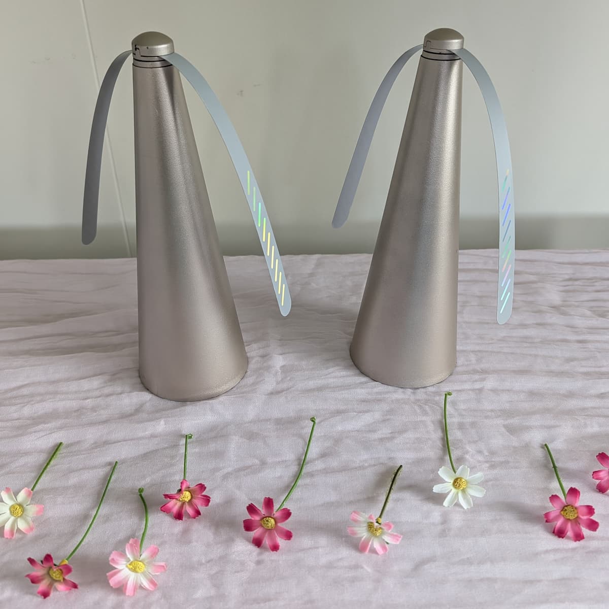 Two silver cone holders with 