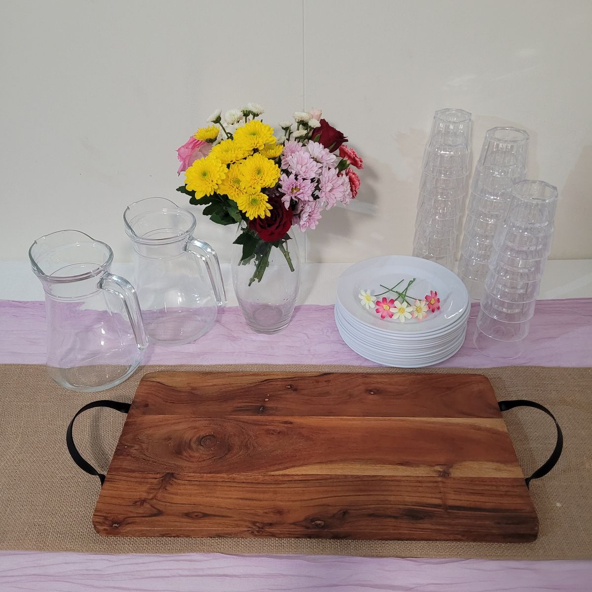 Close-up of a floral bouquet in a clear glass vase on a styled table