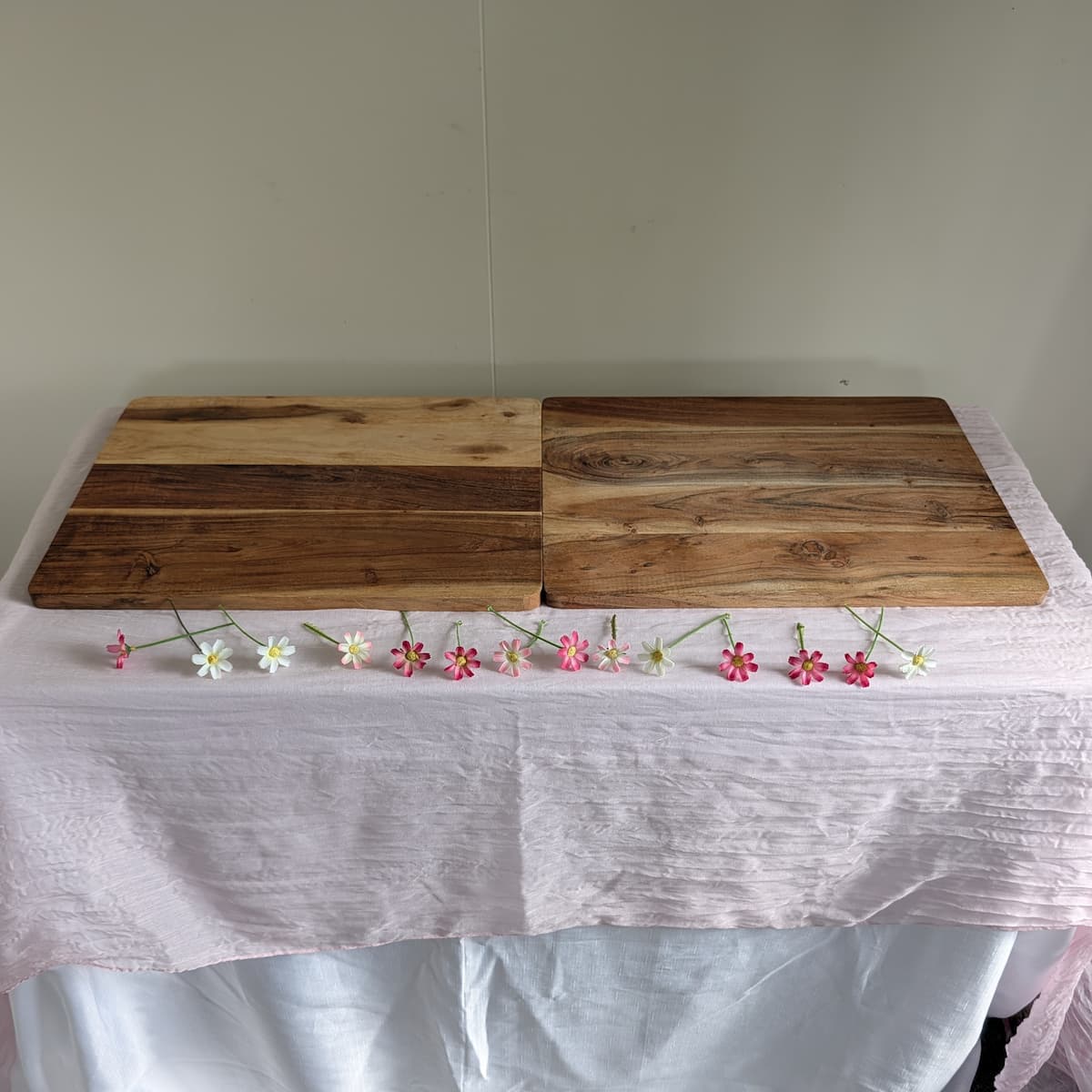 Wood serving platters — both sets on table with pink cheesecloth and daisies
