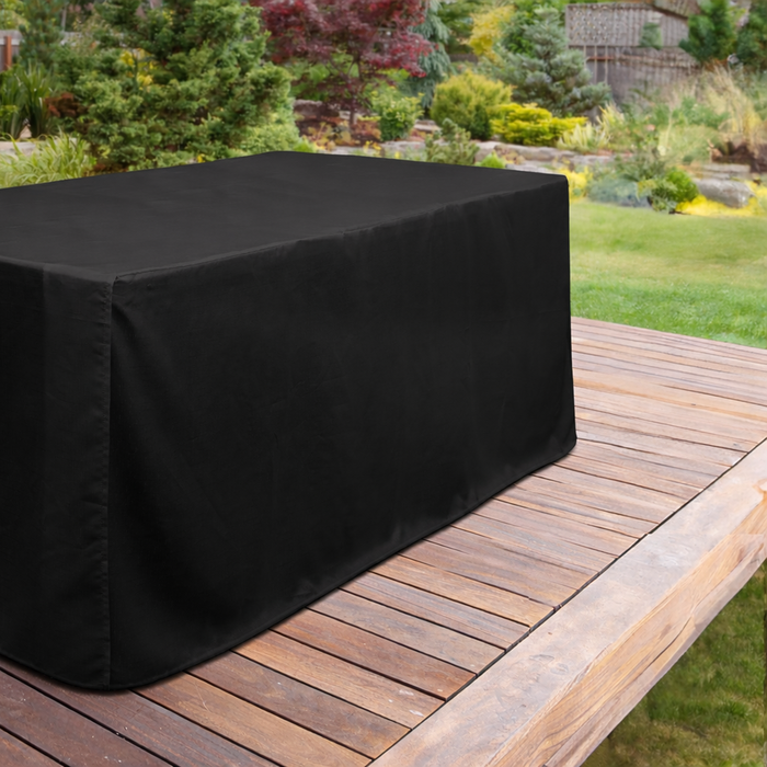 Trestle table with black floor-length tablecloth outdoors