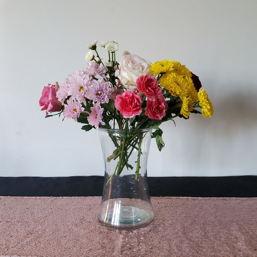 Clear glass hourglass-shaped vase